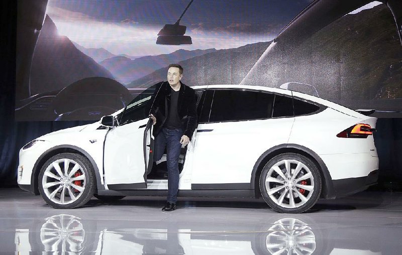 Elon Musk, CEO of Tesla Motors, introduces the Model X car at the company’s headquarters in Fremont, Calif., last month. The Model X is one of the vehicles that will get the autopilot update.
