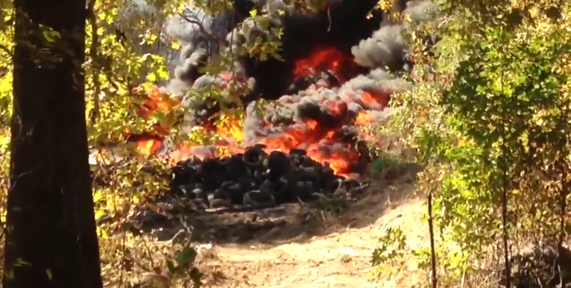 Tires burn in a fire in the area of Pitts Road and Jennings Road on Monday, Oct. 19, 2015. 