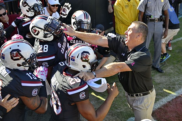 South Carolina interim head coach Shawn Elliott charges up his players before an NCAA college football game against Vanderbilt, Saturday, Oct. 17, 2015, in Columbia, S.C. (AP Photo/Richard Shiro)