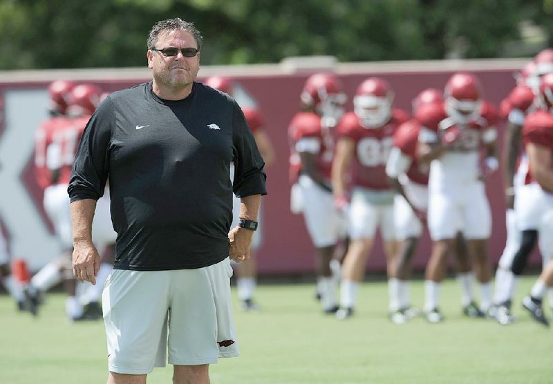 NWA Democrat-Gazette/ANDY SHUPE
Arkansas assistant coach Sam Pittman watches Saturday, Aug. 8, 2015. during practice at the university football practice field in Fayetteville.