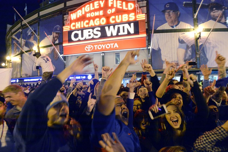 Fans gather on the streets outside of Wrigley Field after the Cubs won 6-4 in Game 4 in baseball's National League Division Series against the St. Louis Cardinals on Oct. 13 in Chicago.