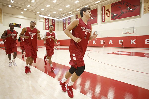 Dusty Hannahs (3) leads Arkansas players in a workout during practice Monday, Oct. 5, 2015, at the Razorbacks' practice facility in Fayetteville. 