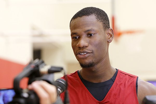 Arkansas center Moses Kingsley speaks to reporters on Monday, Oct. 5, 2015, at the Razorbacks' basketball practice facility in Fayetteville. 