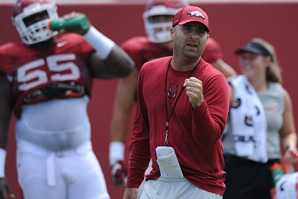 Arkansas tight ends coach Barry Lunney Jr. instructs players Thursday, Aug. 13, 2015, during practice at the university practice field in Fayetteville.