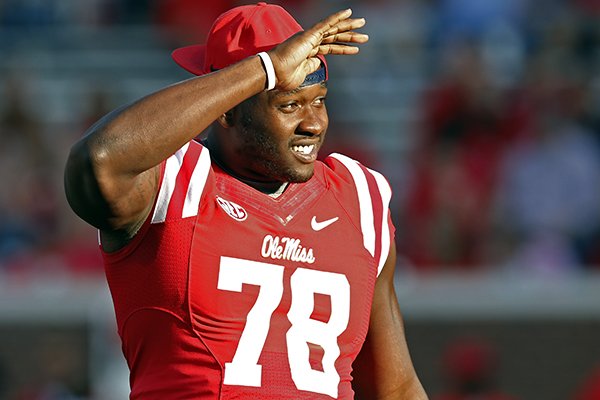 In this Sept. 26, 2015, photograph, Mississippi offensive lineman Laremy Tunsil (78) looks into the stands prior to their NCAA college football game against Vanderbilt, in Oxford, Miss. The NCAA has ruled that Tunsil can return to the field on Saturday, Oct. 24 against No. 15 Texas A&M after a seven-game suspension for receiving improper benefits. (AP Photo/Rogelio V. Solis)