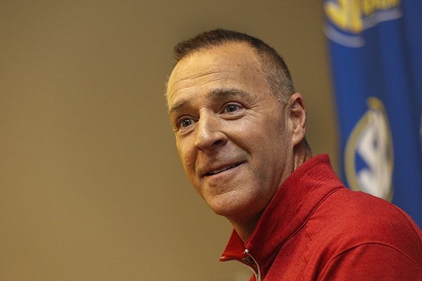 Arkansas women's NCAA college basketball coach Jimmy Dykes smiles as he listens to a question during the Southeastern Conference women's media day in Charlotte, N.C., Thursday, Oct. 22, 2015. (AP Photo/Nell Redmond)