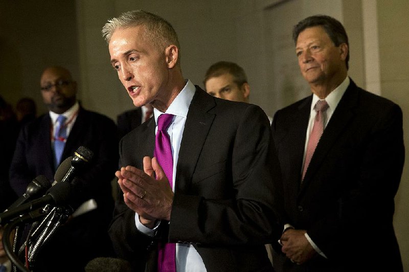 Rep. Trey Gowdy, R-S.C., chairman of the House committee on Benghazi, standing with Rep. Lynn Westmoreland, R-Ga., said Thursday’s hearings were “a constructive interaction” with Hillary Rodham Clinton.
