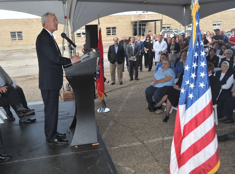 Gov. Asa Hutchinson speaks Thursday during the groundbreaking for the Riverview Hope Campus in Fort Smith. The new facility will have a 75-bed shelter, medical and dental care, adult education, laundry service, meals and showers to help homeless families get help as they work on getting back on their feet. 
