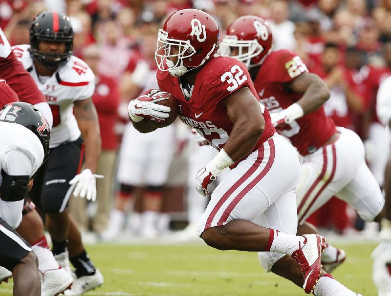 Running back Samaje Perine ran for 201 yards and four touchdowns Saturday to lead No. 17 Oklahoma to a 63-27 victory over Texas Tech in Norman, Okla. 