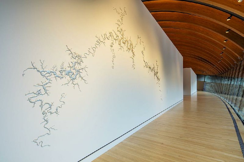 Silver Upper White River, part of the permanent collection at Crystal Bridges Museum of American
Art in Bentonville, is displayed on a wall picked by the artist.