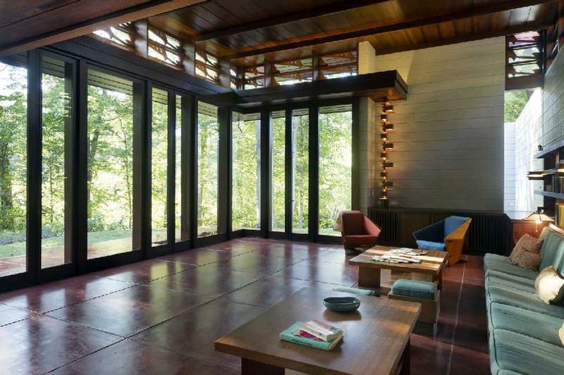 Walls of windows provide a view of native plants at the Frank Lloyd Wright-designed Bachman-Wilson House, which has moved from its original location in New Jersey to the grounds of Crystal Bridges Museum of American Art. It is scheduled to open Nov. 11. 
