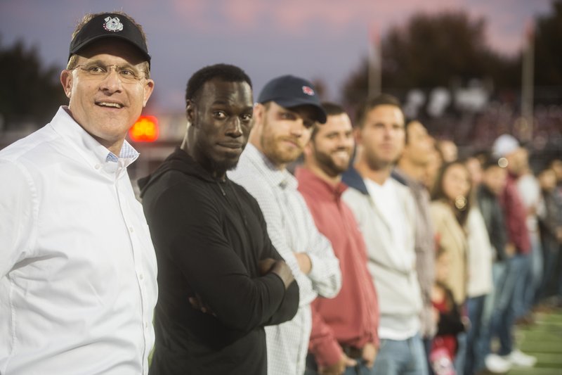 Gus Malzahn (left) former Springdale head football coach talks with former players from the 2005 season Friday, Oct. 23, 2015 before the game against Fort Smith Northside at Jarrell Williams Bulldog Stadium in Springdale.