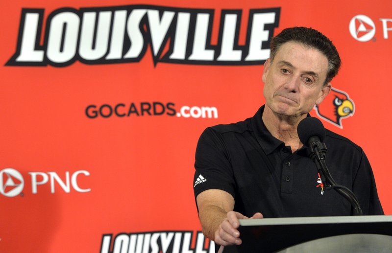 In this Oct. 3, 2015, file photo, Louisville head coach Rick Pitino responds to a question following an NCAA college basketball team's intrasquad scrimmage in Louisville, Ky.