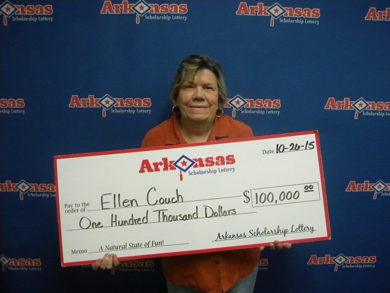 Ellen Couch of Fairfield Bay stands with her check from the Arkansas Scholarship lottery. 