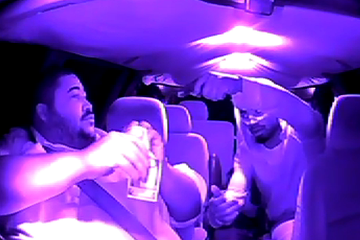 This still from a video released by Conway Yellow Cab shows a passenger robbing a driver at gunpoint.
