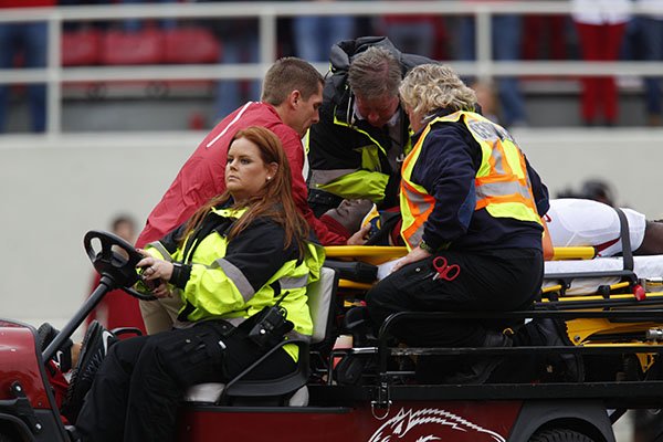 Arkansas running back Rawleigh Williams is carted off the field during a game against Auburn on Saturday, Oct. 24, 2015, at Razorback Stadium in Fayetteville. 