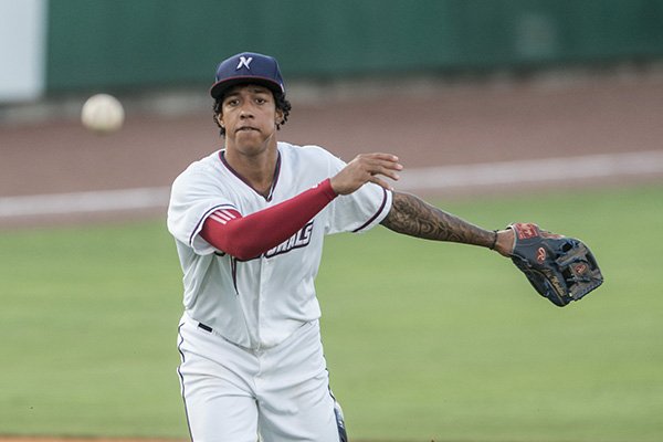 Raul Mondesi, Northwest Arkansas Naturals shortstop, throws to first against the Springfield Cardinals Thursday, July 30, 2015 at Arvest Ballpark in Springdale.