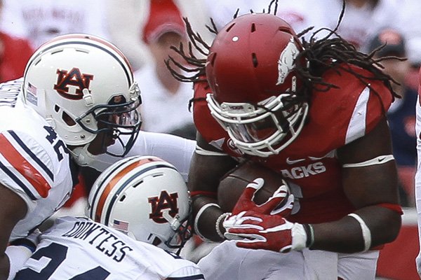 Arkansas running back Alex Collins is tackled during a game against Auburn on Saturday, Oct. 24, 2015, at Razorback Stadium in Fayetteville. 