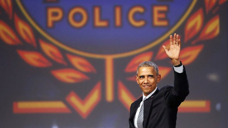 President Barack Obama finishes a speech in Chicago at the annual police chiefs’ conference, where he said he knows officers do their jobs with distinction, “no matter the challenges.” 