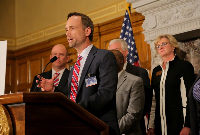 Arkansas Surgeon General Dr. Greg Bledsoe addresses a press conference about the Healthy Active Arkansas plan Oct. 14 at the State Capitol in Little Rock.