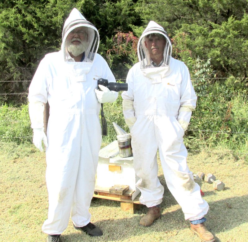 Submitted Photo Mike Eckels (left), Westside Eagle reporter, and Harold Holt show off the bee suits they used to investigate a new colony Sept. 24. The colony started with around 20,000 bees and yielded Holt about 1.5 gallons of honey last season.