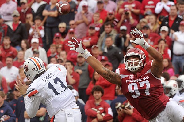 Arkansas defensive end Tevin Beanum pressures Auburn quarterback Sean White during a game Saturday, Oct. 24, 2015, at Razorback Stadium in Fayetteville. 