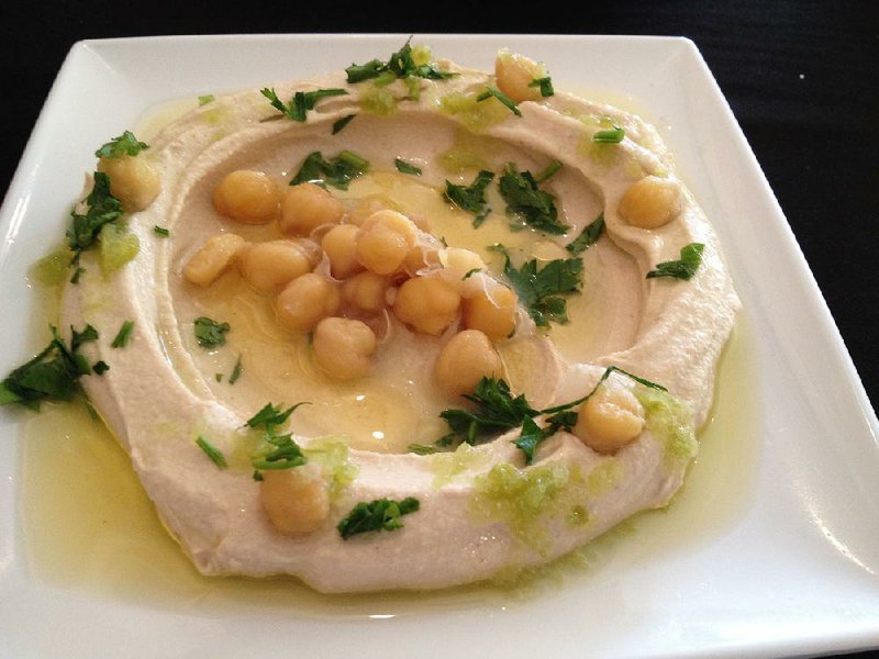 Chickpeas garnish the creamy Tahini Hummus at Salt & Pepper Middle-Eastern Restaurant, in the Galleria Shopping Center on North Rodney Parham Road. 