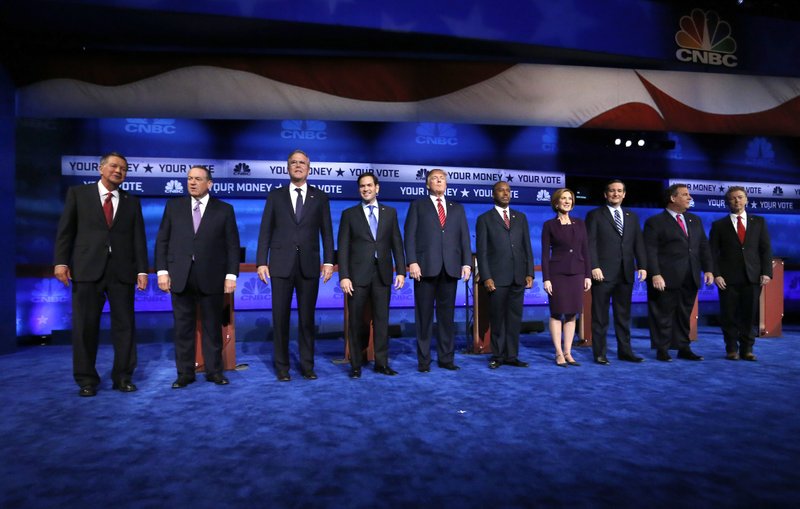 Republican presidential candidates, from left, John Kasich, Mike Huckabee, Jeb Bush, Marco Rubio, Donald Trump, Ben Carson, Carly Fiorina, Ted Cruz, Chris Christie, and Rand Paul take the stage during the CNBC Republican presidential debate at the University of Colorado, Wednesday, Oct. 28, 2015, in Boulder, Colo. 