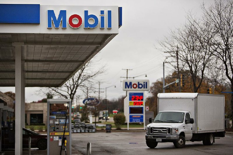 A truck pulls into an Exxon Mobil gas station in Rockford, Ill., earlier this week. Exxon on Friday reported a quarterly profit of more than $4.2 billion.
