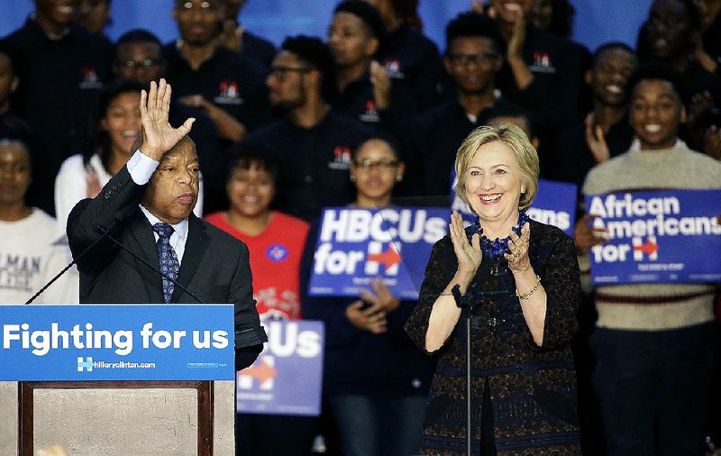 Democratic presidential candidate Hillary Rodham Clinton, right, and Rep. John Lewis, D-Ga., step onstage during a campaign event for Clinton at Clark Atlanta University Friday, Oct. 30, 2015, in Atlanta. 