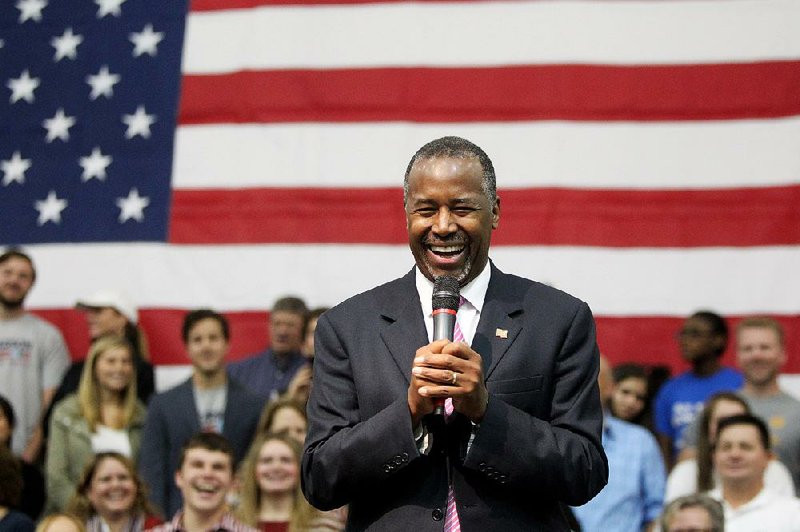 Republican presidential candidate Ben Carson smiles during a campaign rally at West Memphis High School on Friday, Oct. 30, 2015, in West Memphis, Ark. 