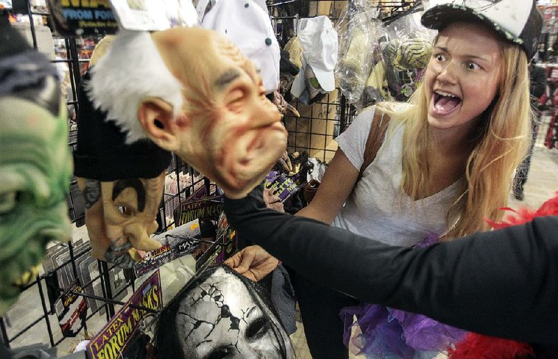 Lianda Creed shops for Halloween costumes Friday to wear while passing out candy to trick-or-treaters. 
