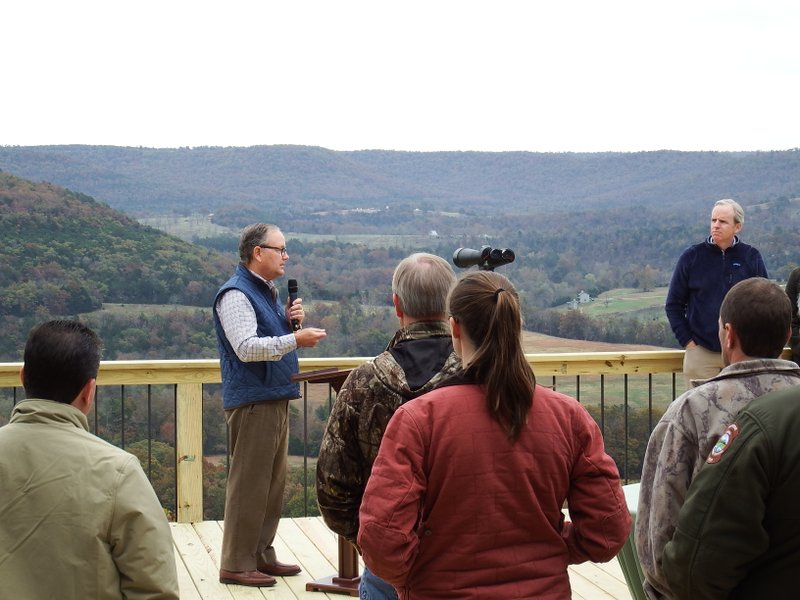 Lee Scott, former CEO of Walmart, speaks Friday at the dedication of 608 acres he and his wife, Linda, gave to expand the Kings River Preserve in Carroll County.
