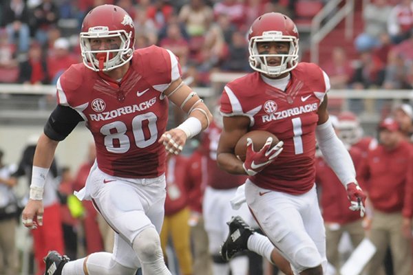 Jared Cornelius (1) of Arkansas carries the ball as Drew Morgan blocks against UT-Martin Saturday, Oct. 31, 2015, during the second quarter at Razorback Stadium in Fayetteville. 