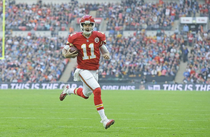 Kansas City Chiefs quarterback Alex Smith scores on a 12-yard run during the second quarter Sunday at Wembley Stadium in London.
