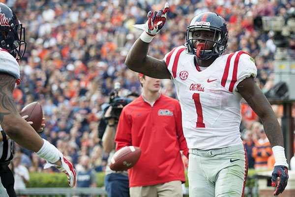 Mississippi wide receiver Laquon Treadwell celebrates after scoring a touchdown over Auburn defensive back Carlton Davis (18) during the fourth quarter of an NCAA college football game on Saturday, Oct. 31, 2015, in Auburn, Ala. (Albert Cesare/The Montgomery Advertiser via AP)