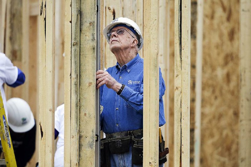 Former President Jimmy Carter works at a Habitat for Humanity building site Monday in Memphis.