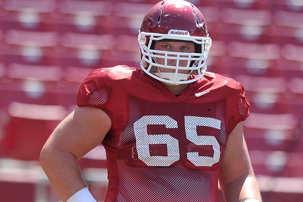 Arkansas offensive lineman Mitch Smothers goes through practice Saturday, Aug. 15, 2015, at Razorback Stadium in Fayetteville. 