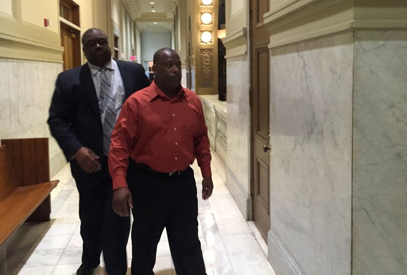 Willie Noble, right, walks into court Tuesday with his attorney, Ron Davis.