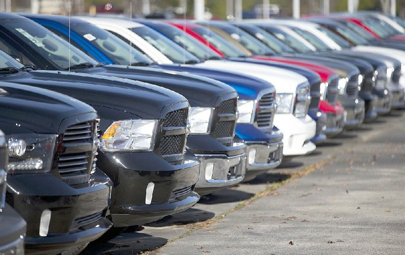 Ram pickups sit on a lot at Landmark Dodge Chrysler Jeep RAM in Morrow, Ga. Automakers reported strong U.S. sales Tuesday, the best two-month stretch in 15 years. 