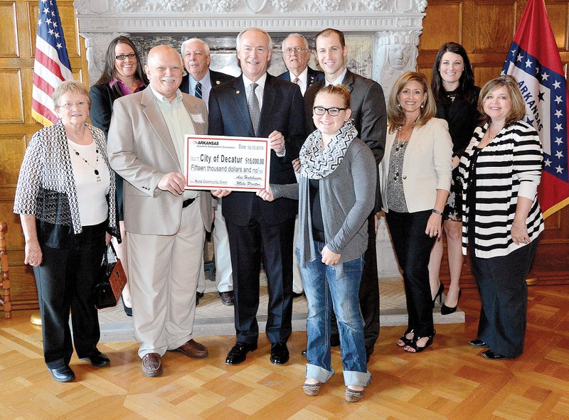 Submitted Photo Decatur Mayor Bob Tharp and several members of the Decatur city council traveled to Little Rock Oct. 12 to except an Arkansas Rural Community Grant check of $15,000 from Governor Asa Hutchinson. Those attending the ceremony at the state capitol building include: Linda Martin, Ladale Clayton, Bob Tharp, Glenn Priebe, Governor Asa Hutchinson, Lonnie Turner, Emily Tharp, Mike Preston, Amy Fecher, Alex Johnston and Kim Wilkins.