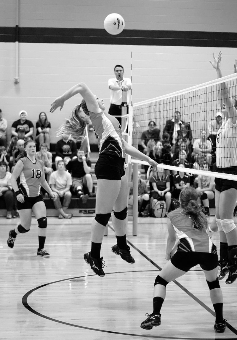 Photo by Randy Moll Amanda Pinter, Gravette senior, spikes the ball across the net in district tournament play against Shiloh Christian at Gravette on Tuesday, Oct. 20, 2015.