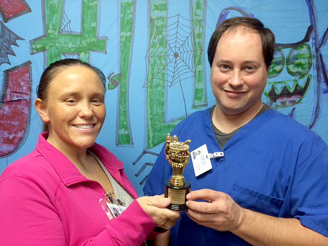 Photo by Amanda Gittlein Leslie South and Clayton Sandridge show off the trophy they were awarded as winners of the best chili in chili cook-off competition at Ozarks Community Hospital Saturday evening. Their &#8220;After Burn Team&#8221; also won a $100 cash prize. Leslie and Clayton work in the dietary department at the hospital.