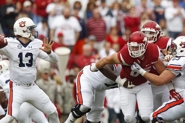 Arkansas defensive Mitchell Loewen (89) tries to pressure Auburn quarterback Sean White (13) during a game Saturday, Oct. 24, 2015, at Razorback Stadium in Fayetteville. 