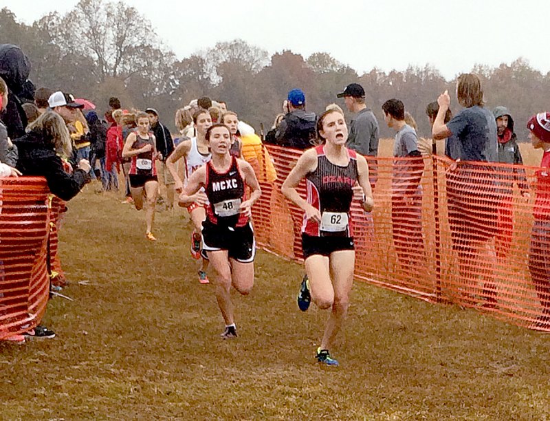 Photo by Rick Peck McDonald County&#8217;s Emily is about to pass Ozark&#8217;s Brocklyn Barber for 17th place at Saturday&#8217;s Missouri Class 4 Sectional 3 Cross Country Championships held at Camdenton.