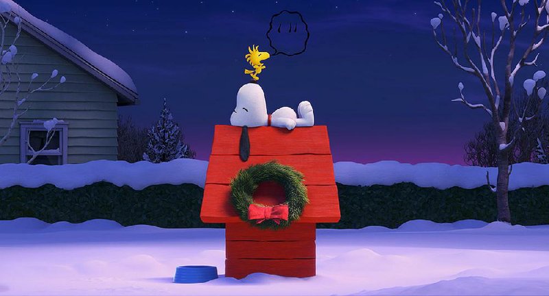 The iconic Snoopy and his yellow pal Woodstock relax atop the temporarily grounded doghouse in a still from The Peanuts Movie.
