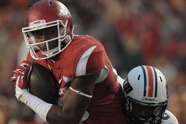 Jeremy Sprinkle (left) of Arkansas heads to the end zone after catching a pass while Logan Burns of UT-Martin defends Saturday, Oct. 31, 2015, during the fourth quarter at Razorback Stadium in Fayetteville. 