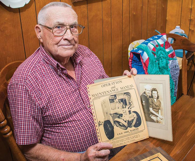 Wayne Charton of Morrilton served in the U.S. Navy during World War II. He enlisted Dec. 7, 1942, and was discharged Nov. 2, 1945. He married his wife, Irene, on April 11, 1944, while he was home on leave. He is shown here holding a photograph of the couple, as well as a page from the instruction manual for the C&G Tree Planter, which he invented in the early 1980s.