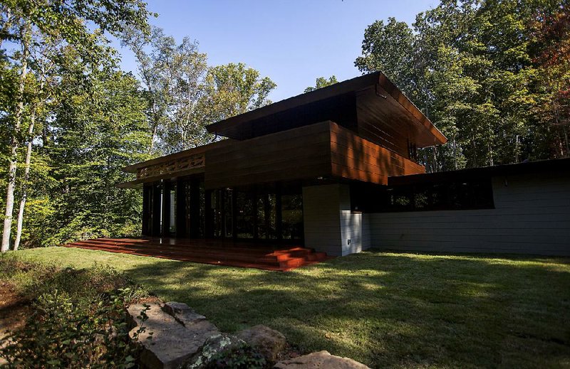 The Bachman-Wilson House, designed by Frank Lloyd Wright, opens to the public Wednesday on the grounds of Crystal Bridges Museum of American Art in Bentonville. The Wood and glass construction face a creek.