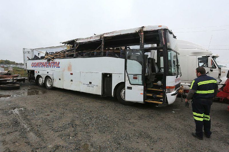 The bus that struck part of the North Hills Boulevard overpass on Interstate 40 early Friday was traveling from Michigan to Texas. The bus was towed to a wrecker yard in North Little Rock.